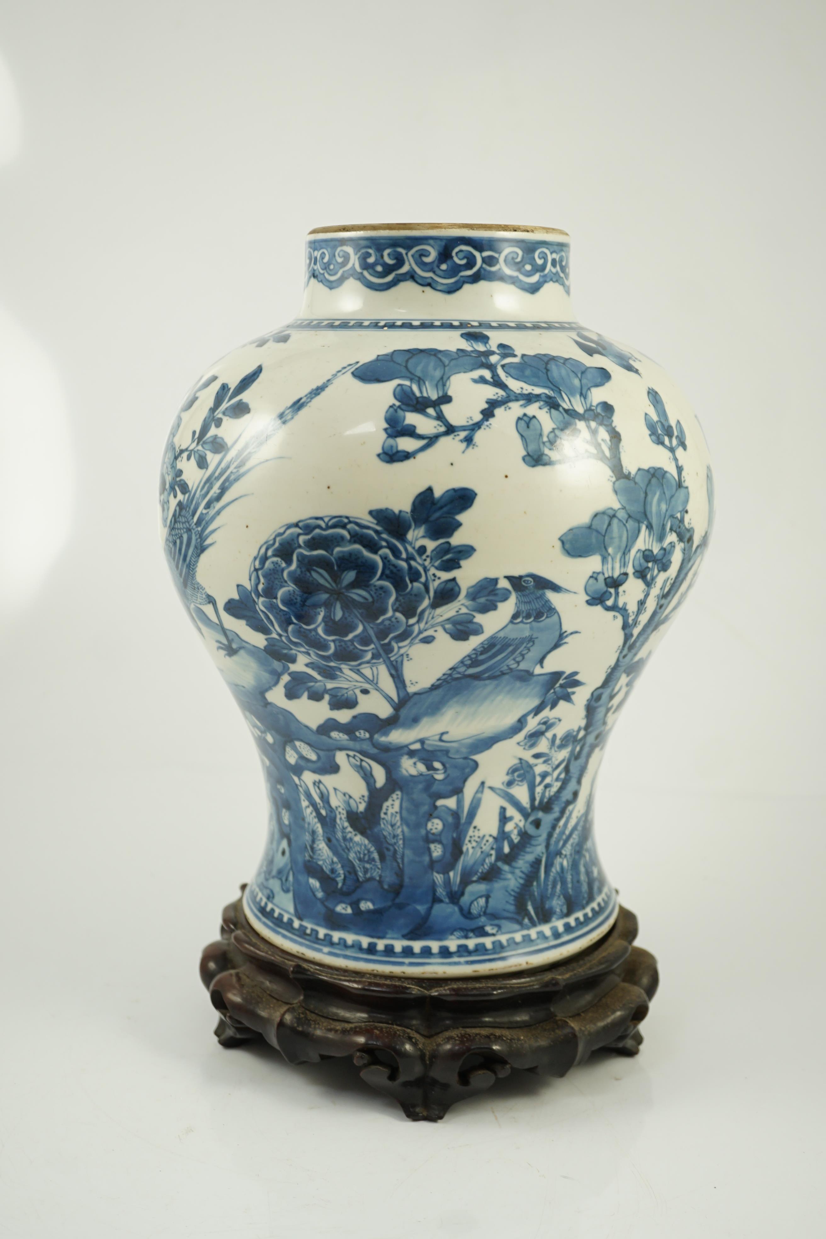 A Chinese blue and white ‘birds and blossom’ baluster vase, Kangxi period